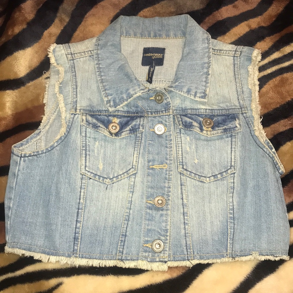 Denim jacket with no sleeves.